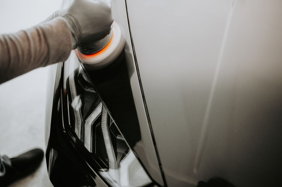 Polishing a black car to a gloss finish